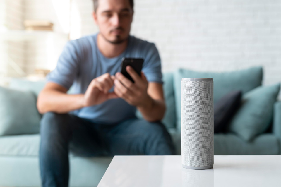 man-using-speaker-digital-assistant.jpg
