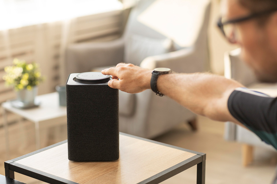 man-using-smart-speaker-while-working.jpg